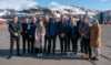 Energiminister Terje Aasland sammen med en lokal delegasjon på besøk hos AM North og Polarbase i Hammerfest.
